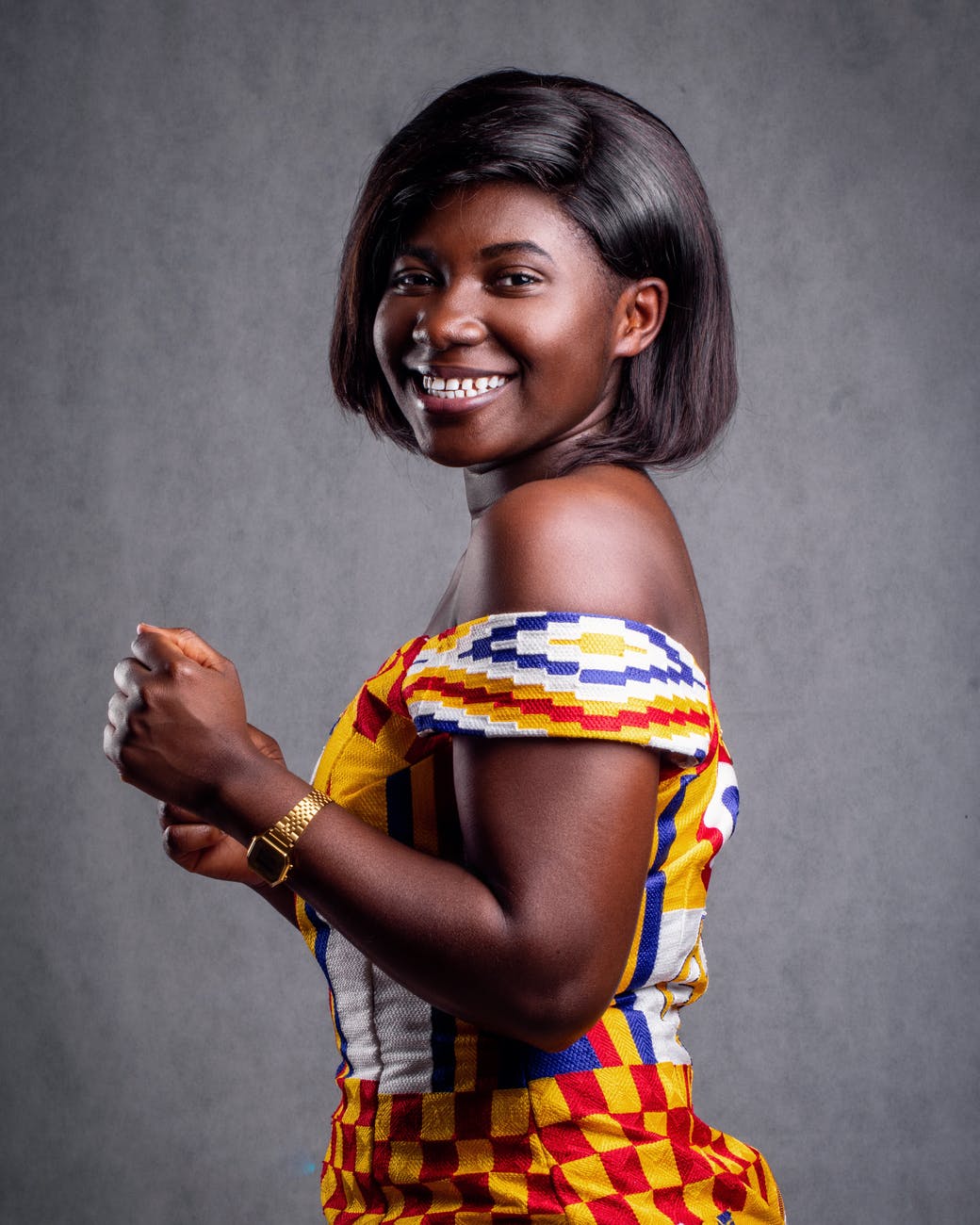 woman wearing kente weaving africa
